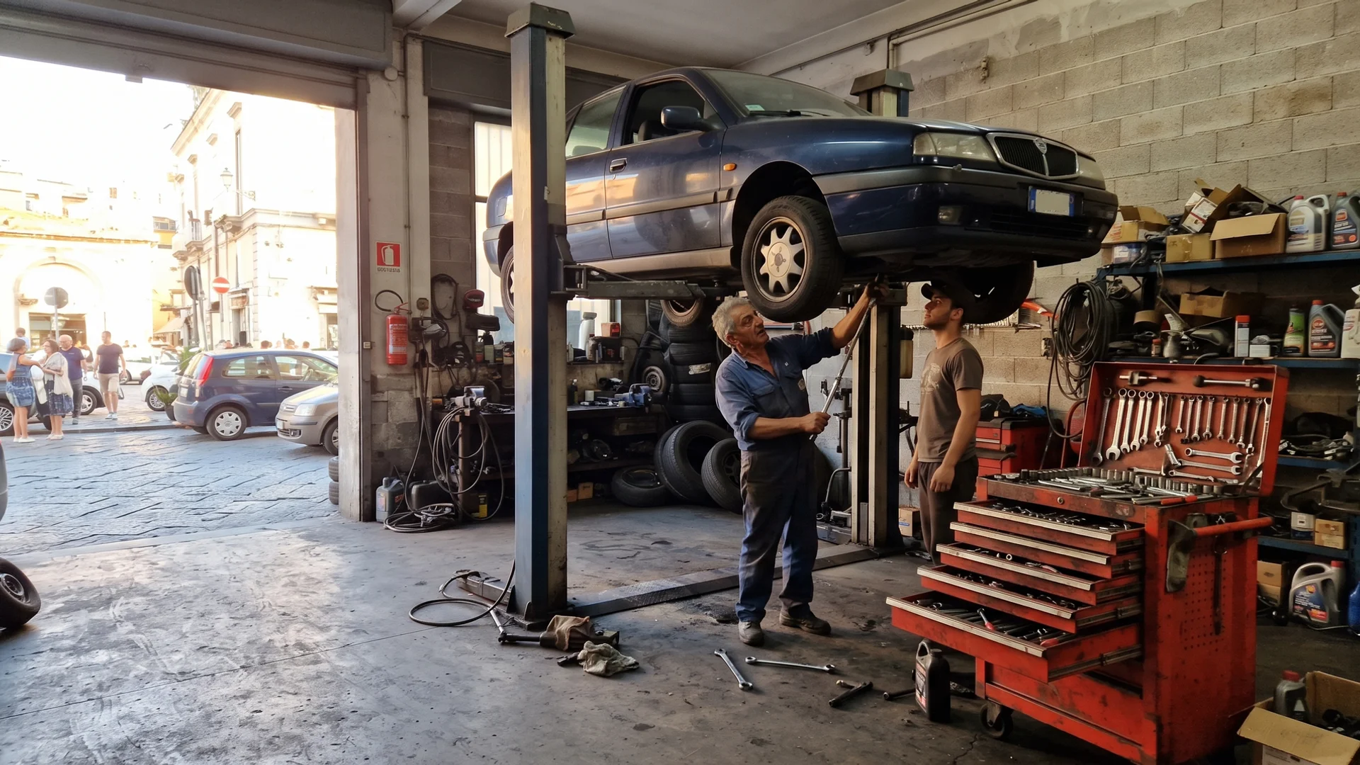 Inside Pinto's Auto Repair in Naples, Florida, with a vehicle raised on a lift in the service bay